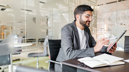 Business professional using tablet in modern office