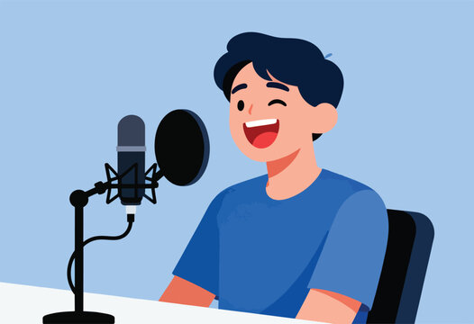 A man winks and smiles while speaking into a microphone with a pop filter, pod-casting at his desk