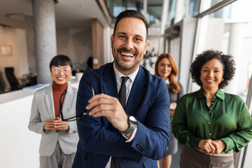 Smiling Team of Professionals in a Modern Office Setting