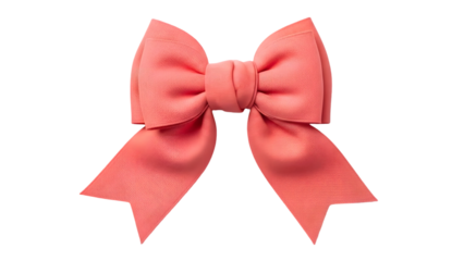 Elegant coral colored satin bow isolated on a solid black background for design elements