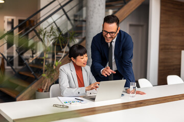 Professional Colleagues Collaborating at Modern Office Workplace on a Project