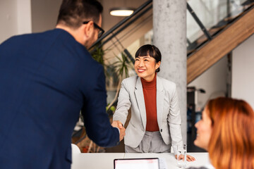 Professional Team Meeting Highlighting Diversity and Collaboration in a Modern Office