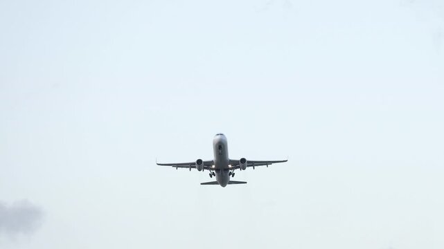 An airplane flying above a field
