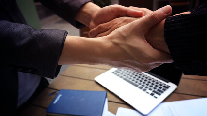 Man hand as lending a helping hand as trust together with compassion concept in the office