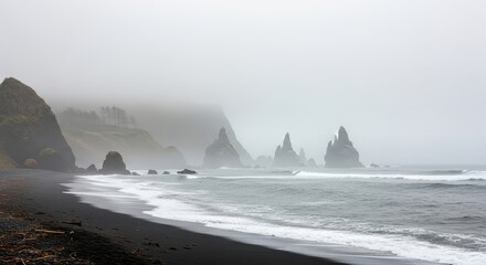 Dramatic Sea Stacks shrouded in mystical fog along the Oregon coast landscape scenic view