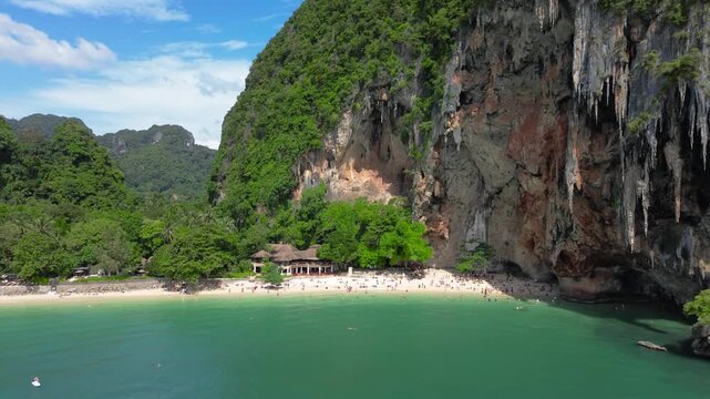 Popular places in Thailand, travel in Thailand. Railay Peninsula, a famous tourist destination. Distance from the beach, crowds on the shore.