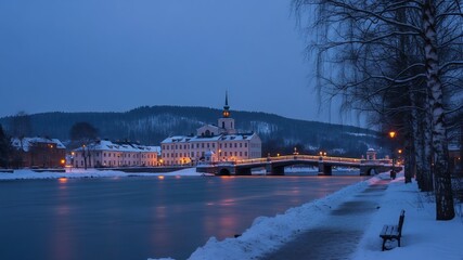 Historic European building, illuminated bridge, and frozen river in a winter town at twilight