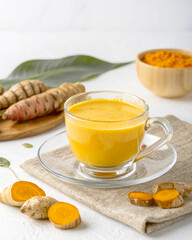 Turmeric Herbal Drink in Clear Glass – Healthy Traditional Yellow Tonic