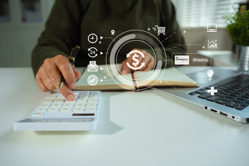 Online payment of hands of women holding smartphone and using credit cards and laptop computers for online shopping.