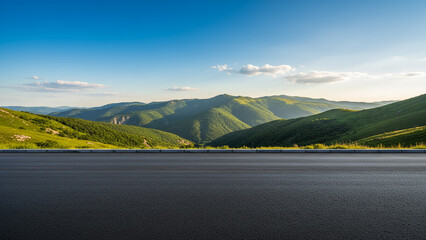 Scenic Mountain Road: Capturing a pristine mountain road that winds through a valley, embraced by lush green hills under a bright blue sky, perfect for travel and adventure.