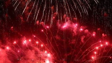 Amazing real beautiful colorful fireworks background on celebration night event for happy new year party, Abstract Multi color golden firework in the night sky