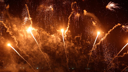 Amazing real beautiful colorful fireworks background on celebration night event for happy new year party, Abstract Multi color golden firework in the night sky