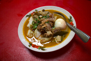 Gulai Ketupat or Rice Cake in Curry, a traditional food from West Sumatera and Jakarta, Indonesia