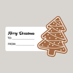 Christmas gift tag with gingerbread tree cookie decorated with white icing. Includes Merry Christmas text and blank To and From lines for personalized holiday gift-giving