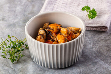 Peeled mussels heap in the bowl