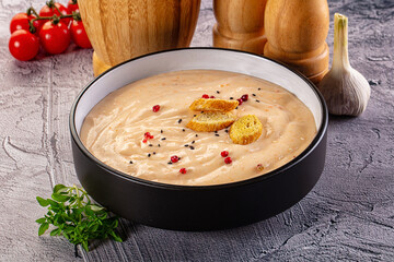 Tasty cheese cream soup with crouton