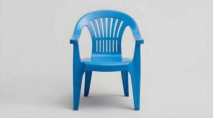 A blue plastic chair on a white background. Ventilation slits run down the backrest, adding both comfort and a distinctive visual pattern. The overall look is practical.