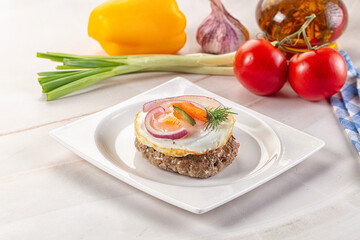 Beefsteak chop with roasted egg