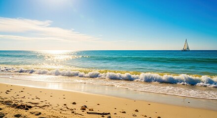 A sailboat sailing on the ocean with a clear blue sky and a sandy beach in the foreground.