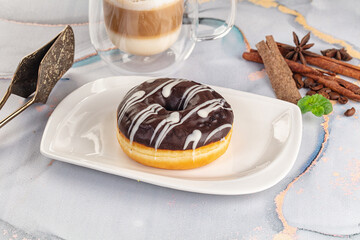 Delicous sweet donut with chocolate glaze