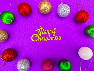 marry christmas purple background with multiple decoration ball