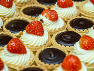 delicious mini fruit tarts with cream and chocolate tarts assortment