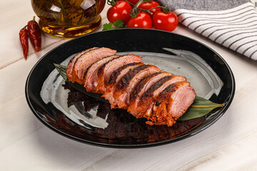 Sliced duck breast baked with cherry