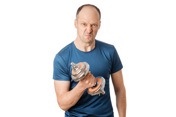 A person is holding a dumbbell with a strong face, indoor setting