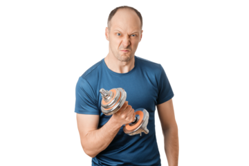 A person is holding a dumbbell with a strong face, indoor setting