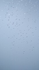 Generative AI depiction of raindrops on a misty sky background capturing natural water droplets in