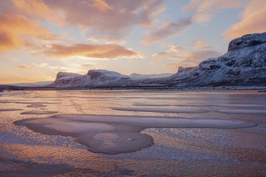 Scenic view of beautiful glacier against dramatic sky