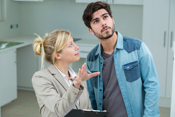 female estate broker showing customer in the property