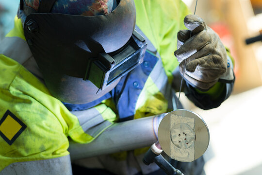 welders working at the factory made metal
