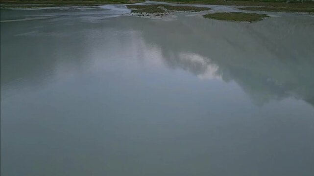 Moiry Glacier Sunrise Aerial Descent Over River and Lake