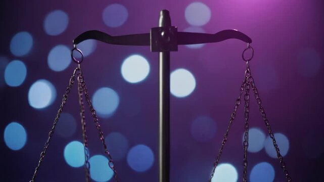 Close-up of a balance scale with chains and a purple background featuring blue and white bokeh lights.