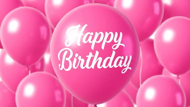 A cluster of pink balloons with "Happy Birthday" written on the largest one
