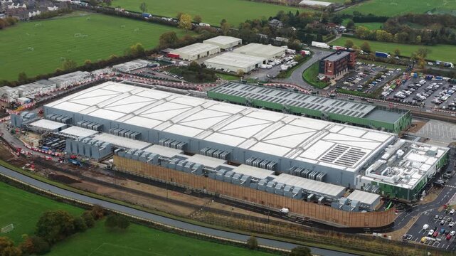 Aerial drone video of a large new-build data center in Waltham Cross, UK, showcasing expanding digital infrastructure designed to meet rising AI-driven computing and cloud processing demands.