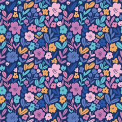Bold floral pattern in hand drawn style. Colorful small flowers on dark blue background. Ditsy seamless print design for kids fabrics, wallpaper or wrapping paper. 