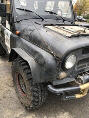 brutal SUV covered in road dirt