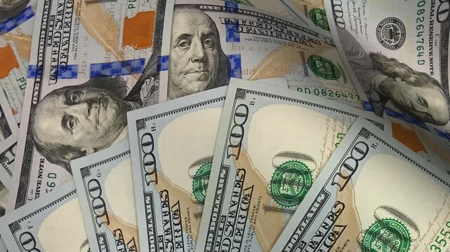 Artistic motion sequence moving along layered waves of hundred dollar bills using detailed banknotes to communicate investment themes that underscore an exclusive vision of cash-powered financial flow