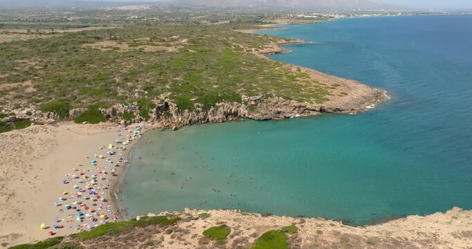 Aerial view of Cala Mosche (or Calamosche) beach, a beautiful sandy beach within the Vendicari Nature Reserve, in province of Syracuse, Sicily, Italy. It's famous for its crystal clear and blue sea.