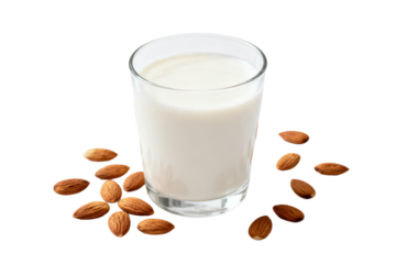 A glass of almond milk with almonds around it