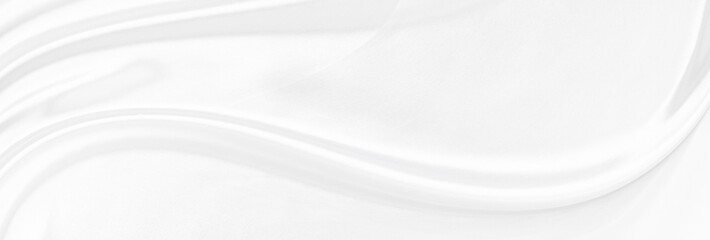White gray satin texture that is white silver fabric silk panorama background with beautiful soft blur pattern natural.
