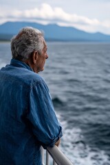 Fototapeta premium Mature caucasian male enjoying ocean view on a boat
