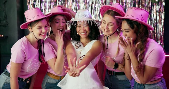 Friends, bride and ring with party, celebration and get together for bachelorette event. Excited, women and smile with love, support and happy for wedding and future commitment with engagement pride