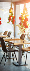 A beautifully designed restaurant interior showcasing a modern and elegant dining area. The space features contemporary furniture, including wooden chairs and tables set with glassware, plates.