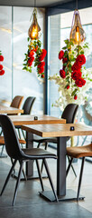 A beautifully designed restaurant interior showcasing a modern and elegant dining area. The space features contemporary furniture, including wooden chairs and tables set with glassware, plates.