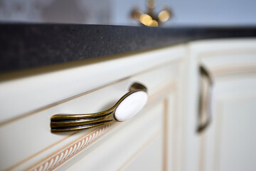 Zinc Alloy Antique Bronze Ceramic White Cabinet Handles selective focus close up shot. Country House Porcelain Handles.