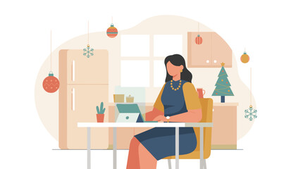Working from home during Christmas holidays Woman using laptop in a decorated kitchen