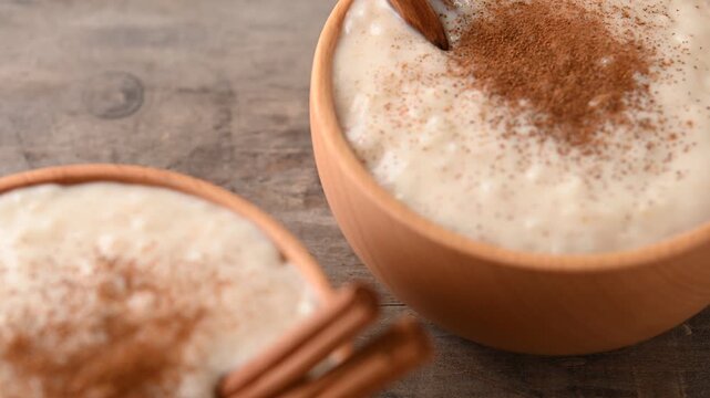 Rice pudding on wooden bowl